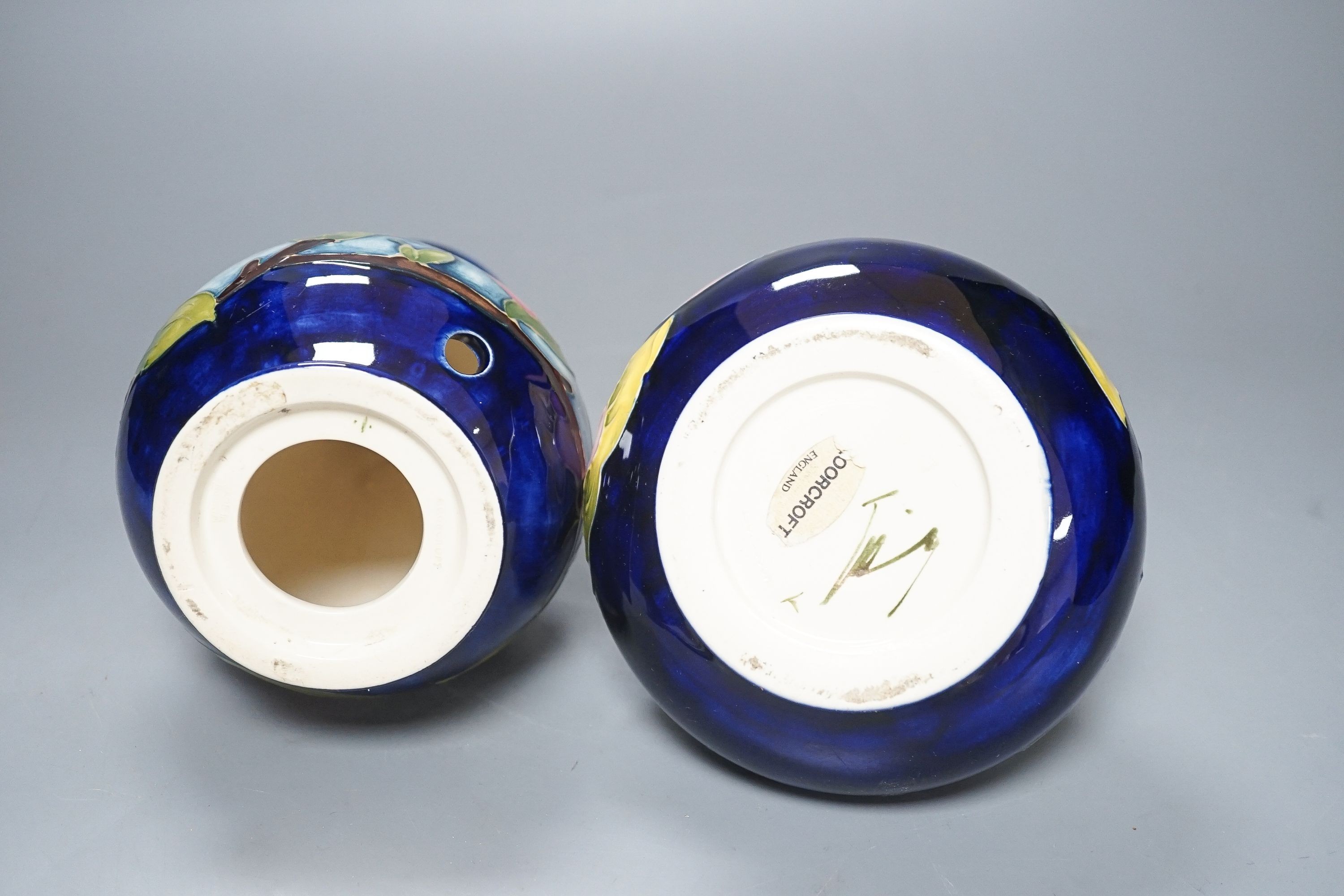 Two Moorcroft magnolia pattern vases 17cm